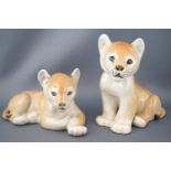A pair of USSR pottery figures of lion cubs, printed marks, 11.