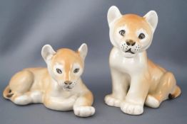 A pair of USSR pottery figures of lion cubs, printed marks, 11.