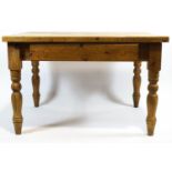 A scrubbed pine kitchen table,