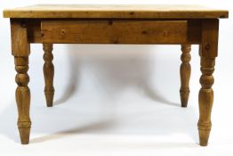 A scrubbed pine kitchen table,