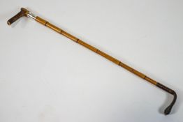 A horn handled bamboo riding crop with silver collar, Birmingham 1886,