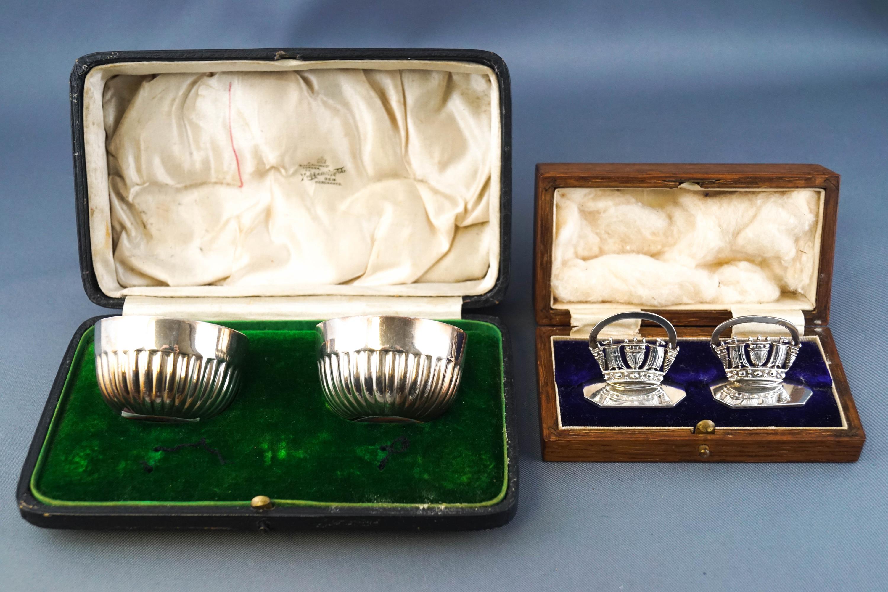 A cased pair of silver menu holders in the form of Naval Coronets, for Page, Keen & Page, Plymouth,