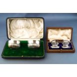 A cased pair of silver menu holders in the form of Naval Coronets, for Page, Keen & Page, Plymouth,
