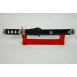 A reproduction mounted samurai sword in scabbard,