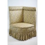 An upholstered corner chair,