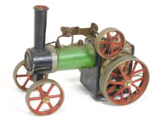 A Mamod traction engine, in green livery with red wheels,
