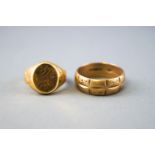 A collection of two rings to include: A yellow metal signet ring stamped 750 for 18ct gold,