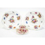 A pair of rounded square two handled dishes, decorated with Deutsche blumen, possibly Coalport,