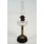 A Victorian oil lamp, with cut glass reservoir on brass column,