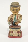 A battery operated tin plate and plastic figure of Charlie Weaver Bartender,