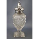 A Victorian style silver and cut glass urn shaped sugar caster with silver screw off pierced lid on