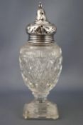 A Victorian style silver and cut glass urn shaped sugar caster with silver screw off pierced lid on