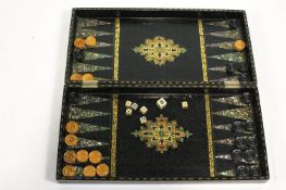 A Victorian papier mache chess board/back gammon set,