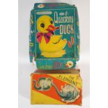 A boxed clockwork Japanese elephant and "A quacking duck",