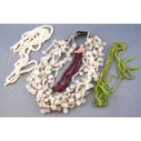 A collection of beads to include a multi strand chalcedony necklace with silver hook clasp;