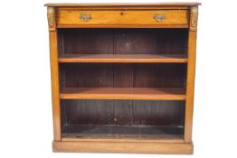 A mahogany standing bookcase, with one frieze drawer flanked by gilt metal mounts,