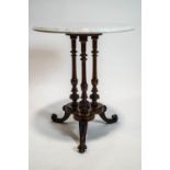 A white marble topped walnut salon table, on a trefoil base,