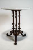 A white marble topped walnut salon table, on a trefoil base,