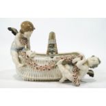 An Amphora porcelain basket decorated with two putti collecting garlands,