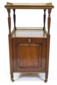 A 19th century mahogany coal purdonium, the two tier top inlaid with a brass gallery,