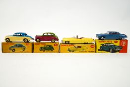 A group of four boxed Dinky toys, to include a 156 Rover saloon, 152 Austin Devon saloon,