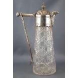 A cut glass and electroplated claret jug, of plain tapering cylindrical form, with a hinged,