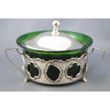 A silver and green glass butter dish, of round form,