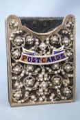 A silver fronted velvet covered strut backed postcard container,