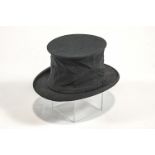 A collapsible top hat, in original box by Foster Bros Hatters,
