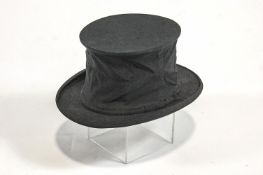 A collapsible top hat, in original box by Foster Bros Hatters,