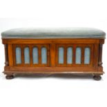 A Victorian walnut ottoman,