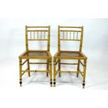 A group of four Bergere faux bamboo dining chairs,