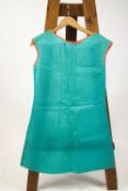 A 1960's paper dress in turquoise with orange cotton trimming,