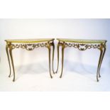 A pair of onyx topped console tables,