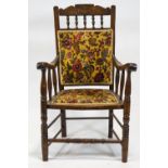 An Edwardian mahogany framed armchair, with upholstered back and seat,