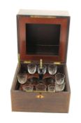 A late 19th century rosewood decanter box, the interior with lift out decanter/glass holder,