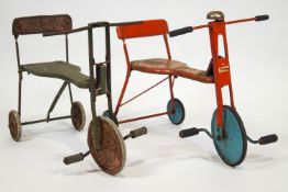 A red Triang tricycle with blue wheels together with another tricycle,