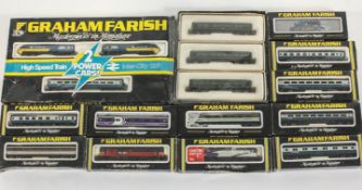 A group of over 50 boxed Graham Farish locomotives, carriages and wagons,