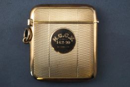 A yellow gold Vesta case measuring 50.0mm x 44.0mm. Engine turned finish with personal inscription.