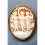 A yellow metal oval cameo brooch with base metal pin together with a pair of oval cameo screw clip