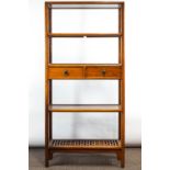 A set of Chinese hardwood shelves with twin central drawers and geometric pieced base shelf,