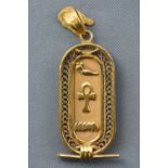 A yellow metal Egyptian cartouche pendant.