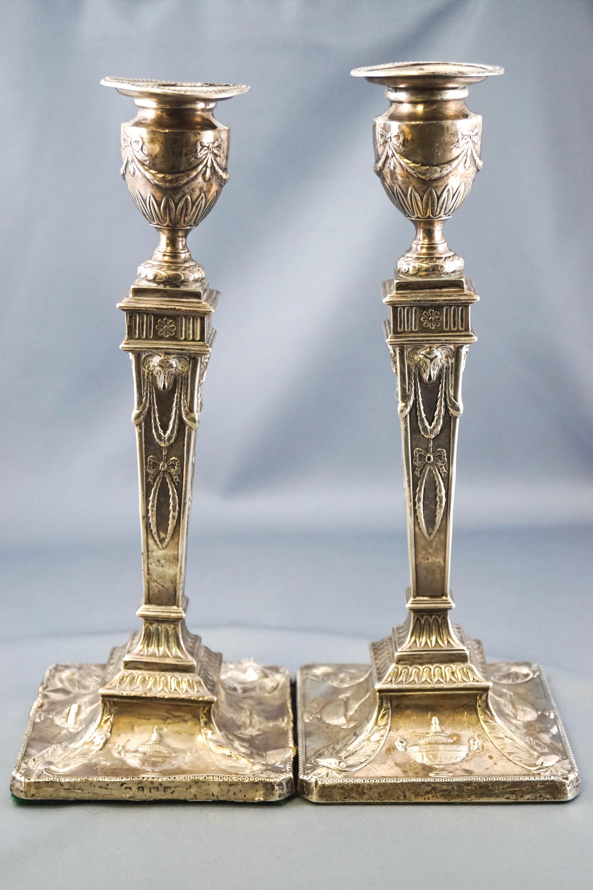 A pair of Robert Adam style silver candlesticks, of tapering squared form,