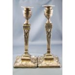 A pair of Robert Adam style silver candlesticks, of tapering squared form,
