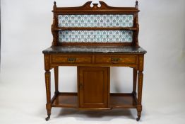 A late Victorian inlaid mahogany marble topped wash stand,