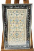 A framed Chinese silk embroidery, decorated with phoenix and butterflies in foliates,