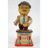 A 1970's tin plate and fabric automated tin plate toy of Charley Weaver Bartender,