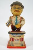 A 1970's tin plate and fabric automated tin plate toy of Charley Weaver Bartender,