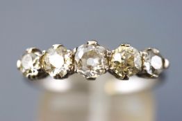 A white metal half hoop ring set with five graduated old European cut diamonds measuring from 3.