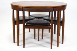 A 1960's Danish teak dining table and set of four chairs, designed by Frem Rojle for Hans Olsen,